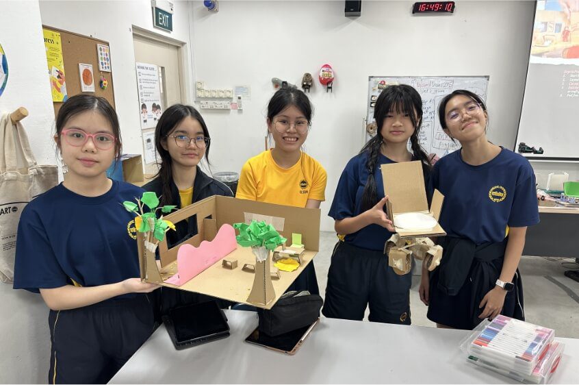 Students presenting prototypes during a design thinking for schools workshop